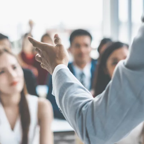 man presenting to an audience